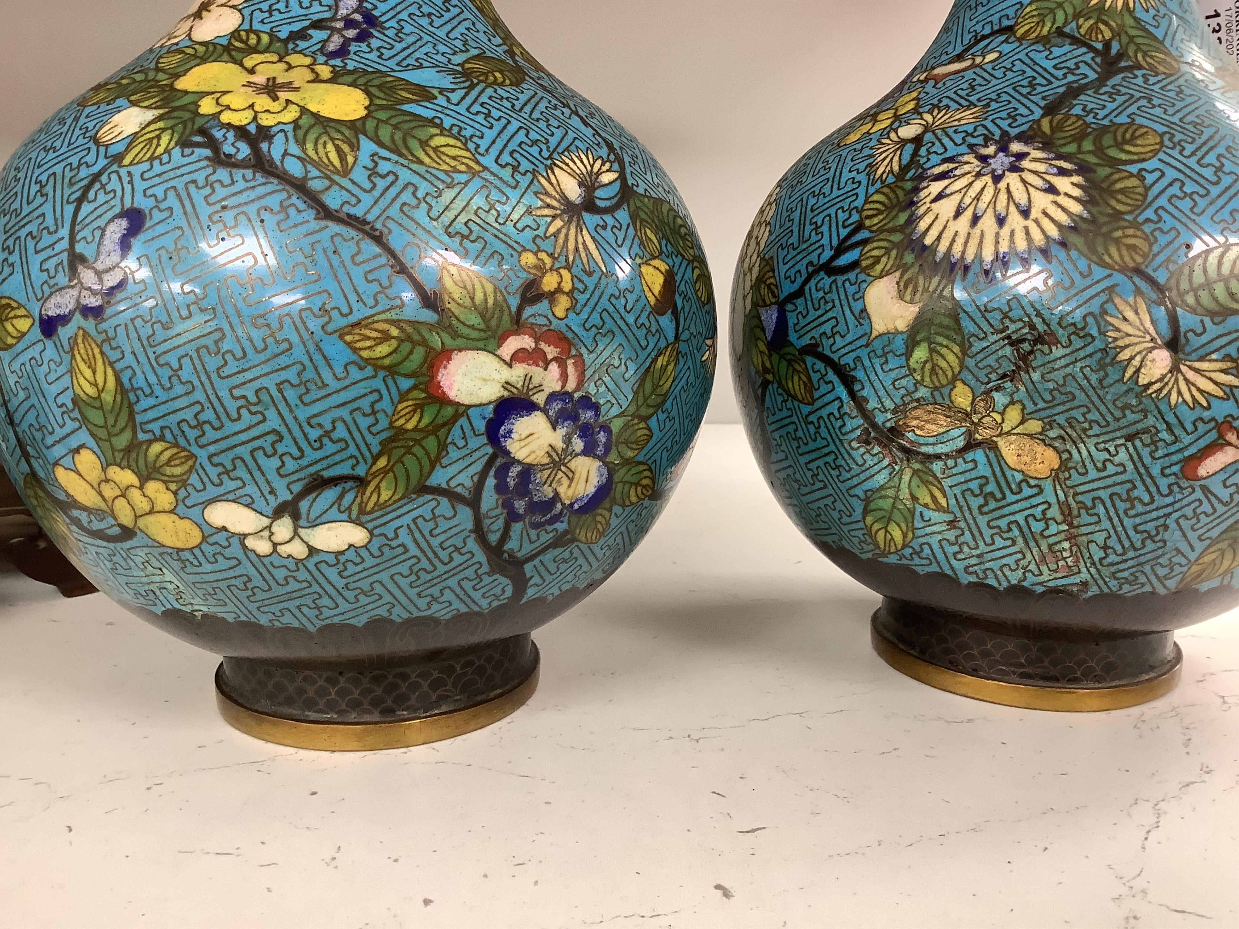 A pair of Chinese cloisonné enamel vases, late Qing dynasty, 31cm, (a.f.), on hardwood stands